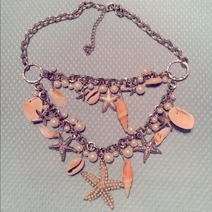 Silvertone, pearl and seashell necklace.